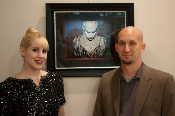 Abstract Portrait Exhibited at Nationally Juried Art Show in Ashland Elsa Littlepage and Chris Hayes next to art deco styled portrait.